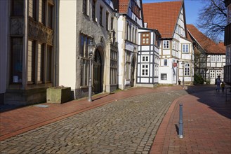 Historic facades and half-timbered houses, lantern and cobblestone street in the Schnurrviertel in
