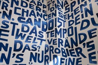 Decorative wall with letters and words, event space Basecamp, Mittelstrasse, Berlin, Germany,