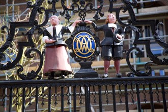 Seventeenth century boy and girl figures outside Weeshuis orphanage, Enkhuizen, Netherlands