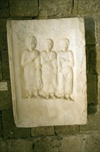 Grave stele two males and a female figures from Nisyros Archaeological museum, Rhodes, Greece,