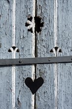 Wooden door with heart, stable door, light-coloured lacquer, weathered, old farmhouse, idyllic,