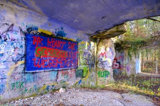 Colourfully painted ruins of a production bunker of the former explosives factory from the Third