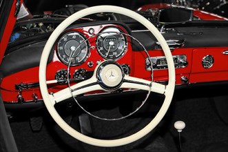 RETRO CLASSICS 2010, Stuttgart Messe, View of the white steering wheel and dashboard of a classic