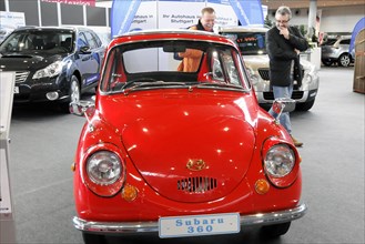 A red Subaru 360 classic car, Subaru 360, presented at a car show, Stuttgart Messe, Stuttgart,