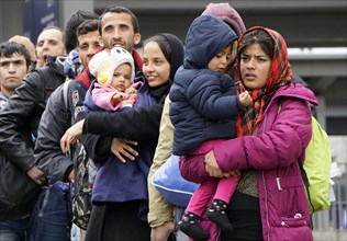 Refugees arriving at Rosenheim station, being taken to registration by federal police officers,