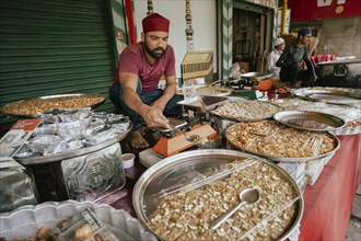 People buy food at a stall to break their fast during the holy month of Ramadan, on March 15, 2024