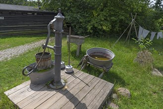 Laundry area with water pump in the garden from the 19th century, Open-Air Museum of Folklore