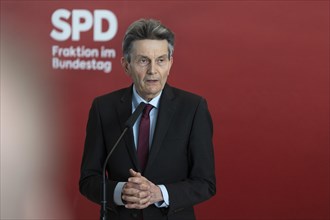 Rolf Muetzenich, SPD parliamentary group leader, gives a press statement in front of the