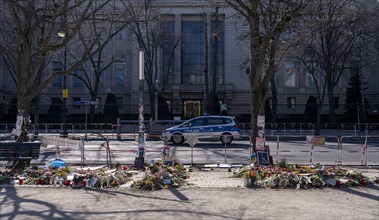 Mourners with flags and flowers in front of the Russian Embassy Unter den Linden, Berlin, Germany,