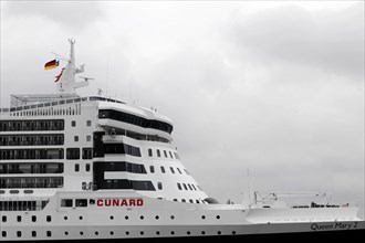 Close-up of the bridge of a cruise ship, Queen Mary 2, under a cloudy sky, Hamburg, Hanseatic City