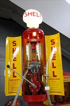 RETRO CLASSICS 2010, Stuttgart Messe, Old red and yellow Shell petrol pump with vintage charm in an
