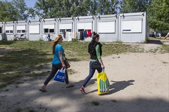 Refugees at the central contact point for asylum seekers in Brandenburg, Eisenhuettenstadt, 3 June
