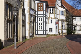 Historic facades and half-timbered houses, lantern and cobblestone street in the Schnurrviertel in