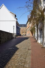 Alley Martinikirchhof with cobblestones and lantern in the city centre of Minden, Muehlenkreis