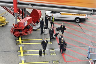 Aircraft crew leaving the aircraft via a gangway on the tarmac, Hamburg, Hanseatic City of Hamburg,