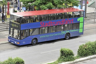 A blue sightseeing double-decker bus at a city bus stop, Hamburg, Hanseatic City of Hamburg,