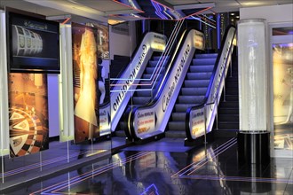 Lively cinema area with neon lighting and escalators, Hamburg, Hanseatic City of Hamburg, Germany,