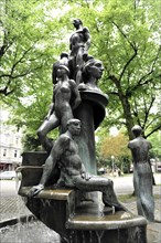 Fountain with sculptures of female figures surrounded by urban greenery, Hamburg, Hanseatic City of