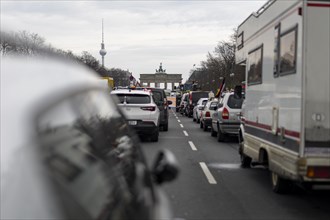 Vehicles blocking Strasse des 17. Juni, Brandenburg Gate and Berlin TV tower in the background,