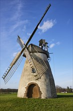 Windmill Auf der Hoechte with blue sky and small white clouds in Hille, Muehlenkreis