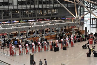 Check-in area of an airport with travellers and luggage, Hamburg, Hanseatic City of Hamburg,