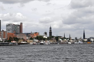 View of a city from the water with church towers and modern buildings, Hamburg, Hanseatic City of