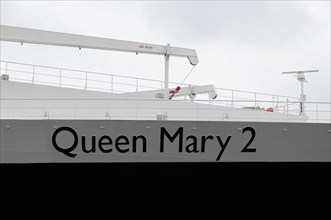 Close-up of the railing of the Queen Mary 2 with focus on the ship's name, Hamburg, Hanseatic City