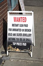 Sign offering to buy unwanted or broken gold, silver jewellery, England, UK