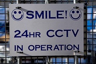 Smile 24 hour CCTV in operation sign, England, UK