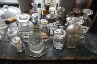 Glass jars for the production of medicines stand in the former laboratory in the historic Berg