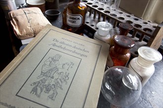 An old book on German pharmacy regulations lies on a worktable in the former laboratory of the