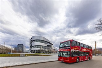 Stuttgrt Citytour. City tour in a red double-decker. City view of Stuttgart in front of the