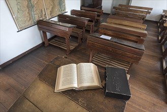 Classroom with Bible on the teacher's desk and school desks from the 19th century, Open-Air Museum