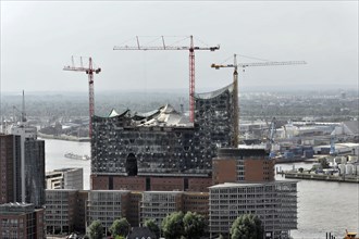 Elbe Philharmonic Hall and surrounding construction sites with cranes at the harbour, Hamburg,