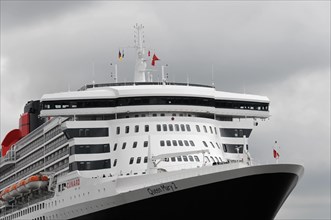 Close-up of the upper decks of a cruise ship Queen Mary 2, with red funnel, Hamburg, Hanseatic City