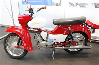 RETRO CLASSICS 2010, Stuttgart Messe, Red and white Simson Schwalbe moped in an exhibition hall,