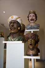 Display of old open mouthed gaper heads traditionally used to identify a pharmacy in Holland,
