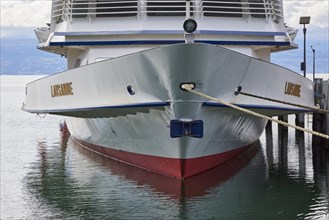 Passenger ship Lausanne lies in Lake Geneva and is moored with her bow with two thaws in the