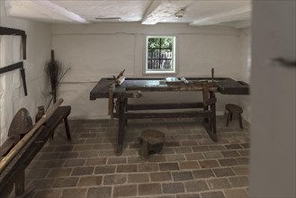 Workroom with workbench and tools in a historic farmhouse from the 19th century, Open-Air Museum of