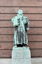Bronze statue of Martin Luther in front of red brick wall, Hamburg, Hanseatic City of Hamburg,