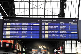 A digital departure board shows the next train connections at a railway station, Hamburg, Hanseatic