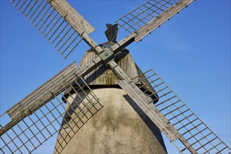 Wings of the windmill Auf der Hoechte under a cloudless blue sky in Hille, Muehlenkreis