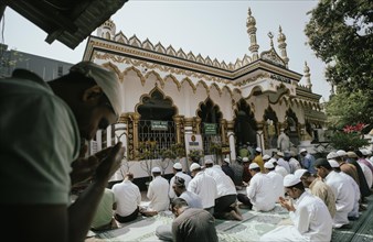 Muslim devotees offer the first Friday prayers of the holy month of Ramadan at a Mosque, on March