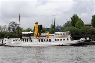 A restored historic steamship, SCHAARHOeRN, moored on the shore, Hamburg, Hanseatic City of