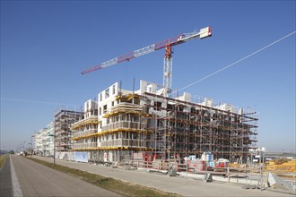 Shells of residential buildings in Bremen's Ueberseestadt, scaffolding, construction site, Bremen