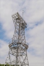 Tall steel communication tower against a blue sky, in Ulsan, South Korea, Asia