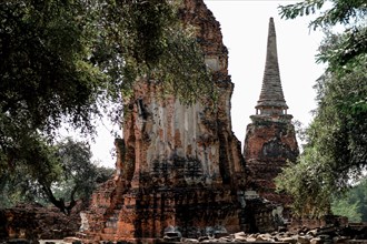 Ancient temple ruins in Wat Choeng Tha, part of the famous Ayutthaya Historical Park in Thailand.
