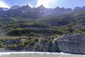 Waterfall, floating ice, mountain range, Andes, Lago Grey, Torres del Paine National Park, Parque