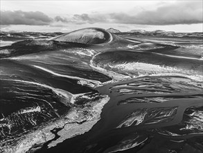 Overgrown river landscape and volcanic landscape, drone image, black and white image, Fjallabak