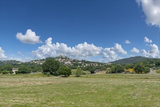 Landscape with a view of the village of Grimaud, above the village the ruins of Grimaud Castle,